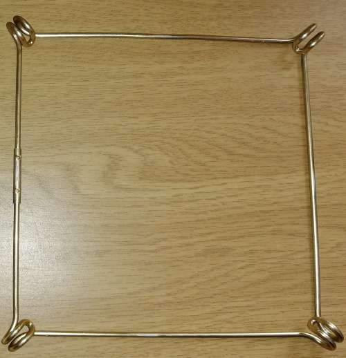 A Collection of three Delft tiles with windmill theme and one tile holder