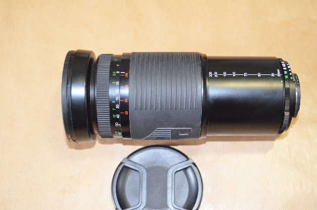 SIGMA 28-300 ZOOM LENS WITH UV FILTER AND FRONT AND REAR CAPS