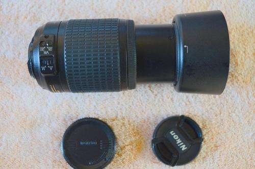 NIKON LENS 55-200 WITH FRONT.REAR CAP AND LENS HOOD