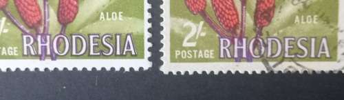 RHODESIA SACC 140-2 SHILLINGS X2 MH/USED WITH FLAW SHIFT OF FLOWER INTO MARGINS