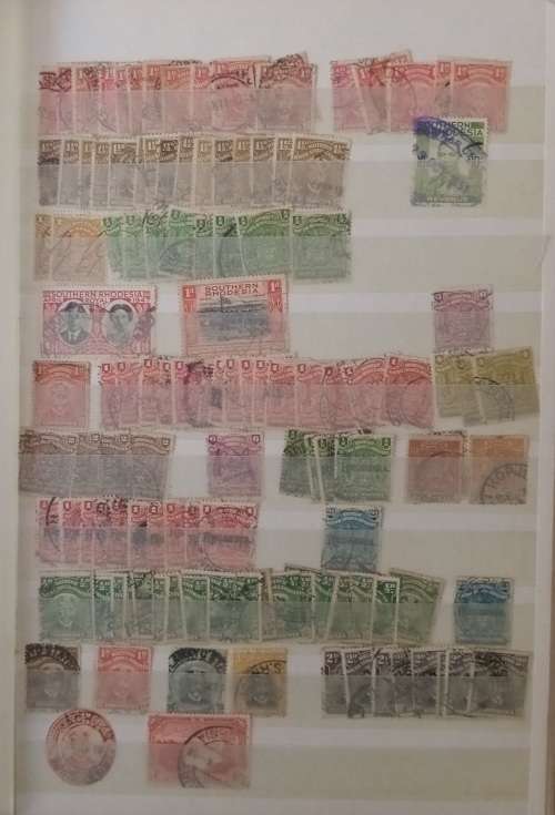 DAVO DEALERS ALBUM WITH STAMPS FROM RHODESIA/RUSSIA/RWANDA AND ROMANIA (#C12)