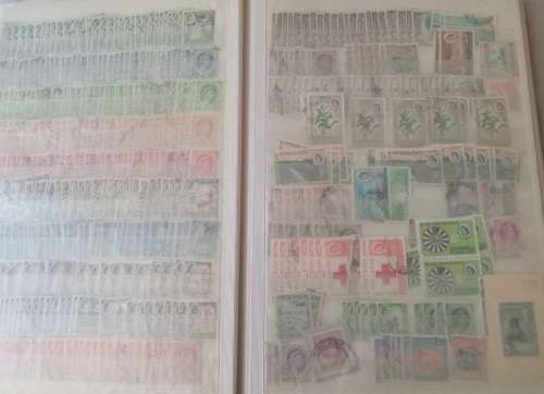 DAVO DEALERS ALBUM WITH STAMPS FROM RHODESIA/RUSSIA/RWANDA AND ROMANIA (#C12)