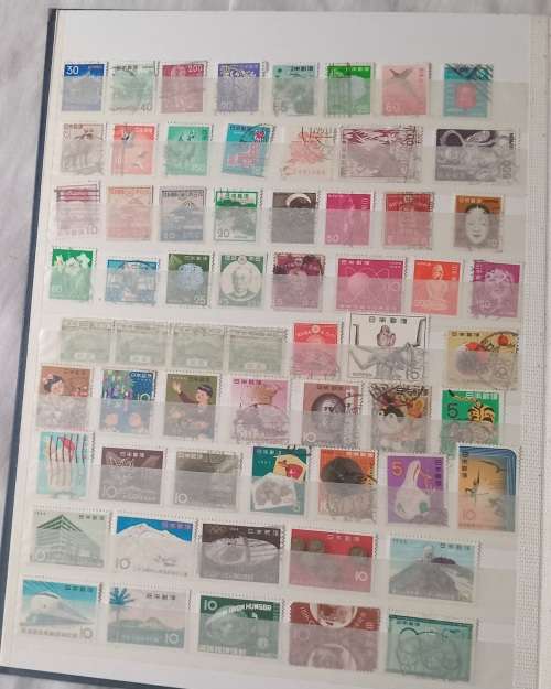 16 PAGESIDEAL STAMPS ALBUM WITH STAMPS FROM THESE COUNTRIES UAE/JAPAN`ROMANIA/LIBERIA/AJMAN/MACAU ,,