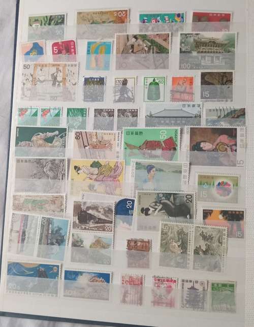 16 PAGESIDEAL STAMPS ALBUM WITH STAMPS FROM THESE COUNTRIES UAE/JAPAN`ROMANIA/LIBERIA/AJMAN/MACAU ,,