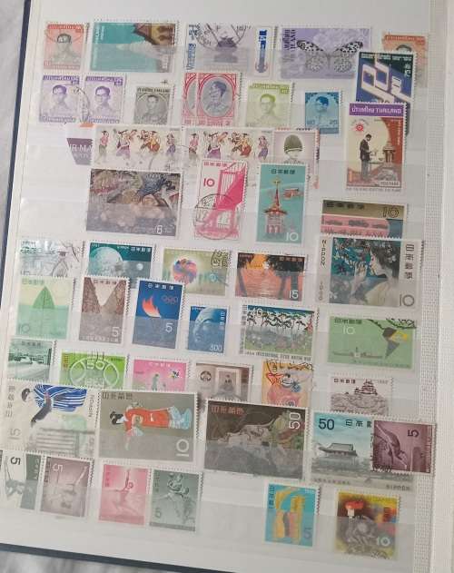 16 PAGESIDEAL STAMPS ALBUM WITH STAMPS FROM THESE COUNTRIES UAE/JAPAN`ROMANIA/LIBERIA/AJMAN/MACAU ,,