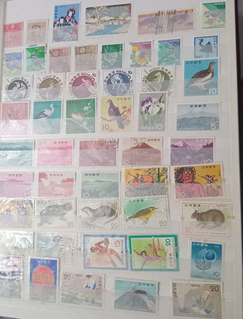 16 PAGESIDEAL STAMPS ALBUM WITH STAMPS FROM THESE COUNTRIES UAE/JAPAN`ROMANIA/LIBERIA/AJMAN/MACAU ,,