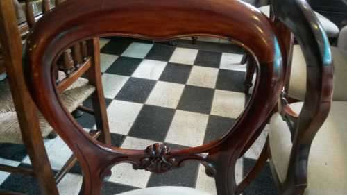 Set of 12 mahogany bustle back chairs upholstered