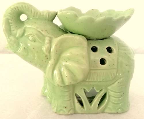 Pale green elephant tea light candle oil burner.