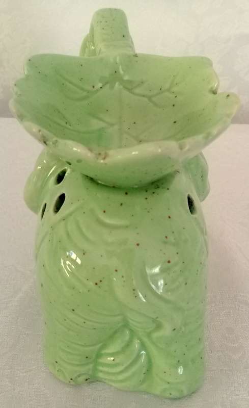 Pale green elephant tea light candle oil burner.