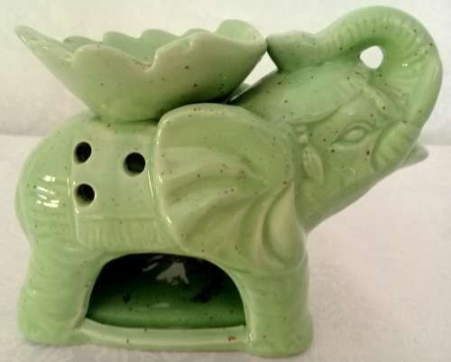 Pale green elephant tea light candle oil burner.