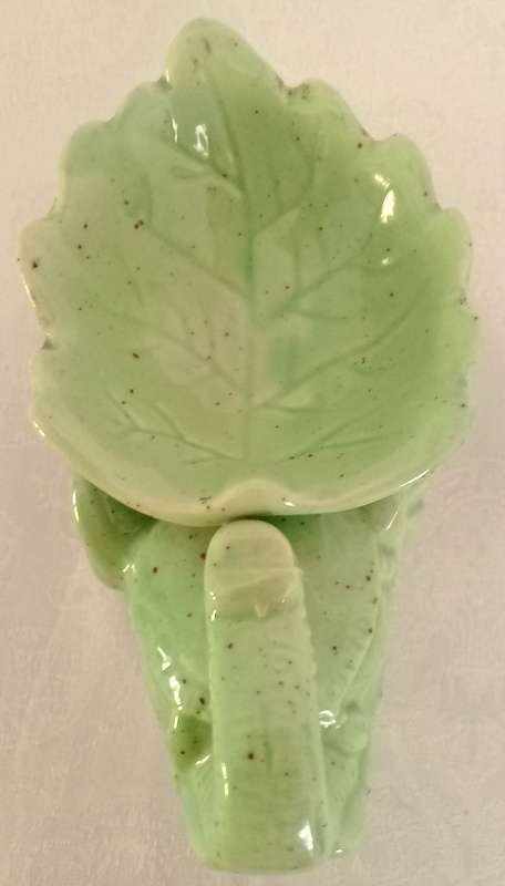 Pale green elephant tea light candle oil burner.