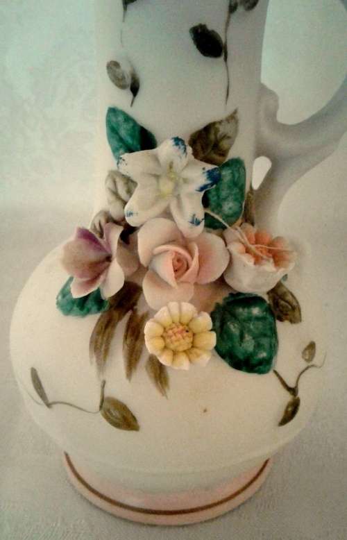 Delightful classical porcelain vase with floral bouquet