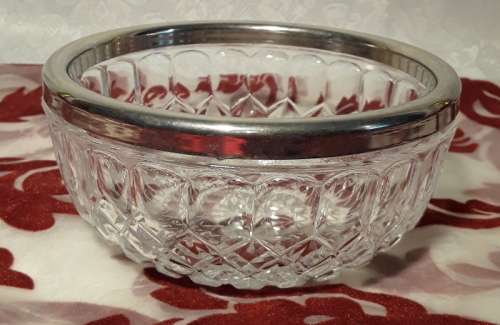 Sought after small glass bowl with EP rim. Stamped England on the inside.