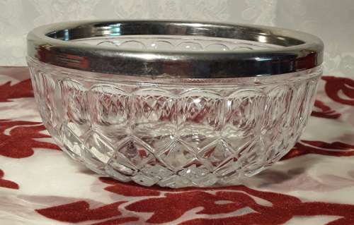 Sought after small glass bowl with EP rim. Stamped England on the inside.