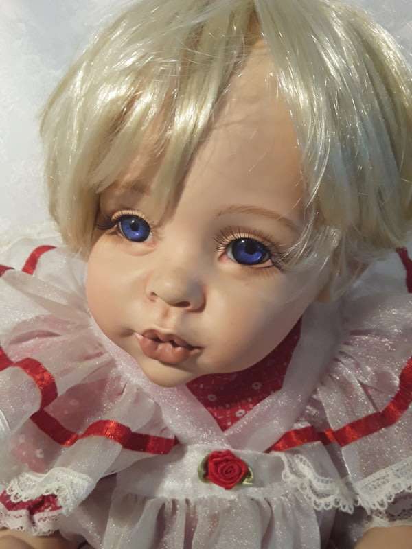 Beautiful porcelain collectable doll.  Made by Rose- Marie's Orphans.
