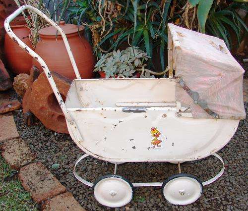 Vintage pink steel doll pram