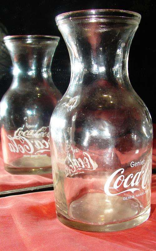 Coca Cola Regd. Mark "Enjoy/Geniet Coca Cola" glass bottle-H 12.5 cm, Bw 6 cm