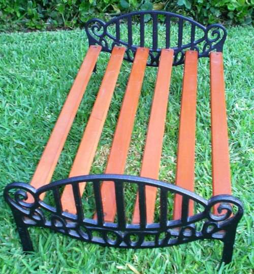 Beautiful and strong Doll wrought/cast iron and wood Cot/bed-good condition
