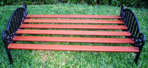 Beautiful and strong Doll wrought/cast iron and wood Cot/bed-good condition