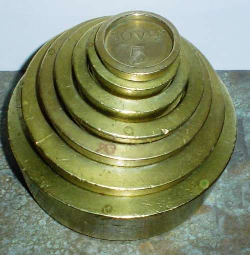Set of 7 solid good quality antique Sovereins brass weights-Used to weigh money in banks