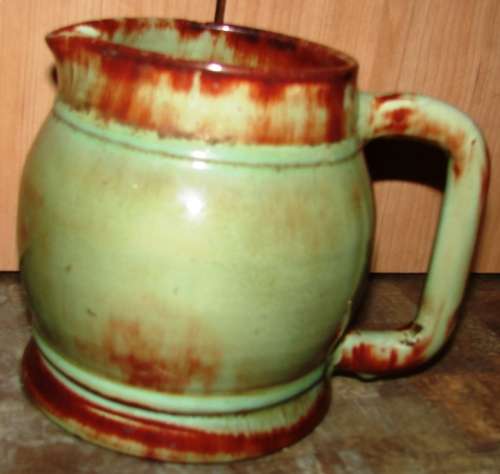 Beautiful green/brown spotted Linn Ware Jug-H 14 cm, Top dia.with handle 17 cm-small chip on rim