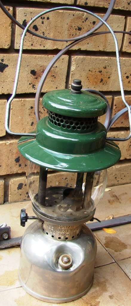 Green and silver Coleman Model 249- Made in Canada 05/1957 Kerosene lamp