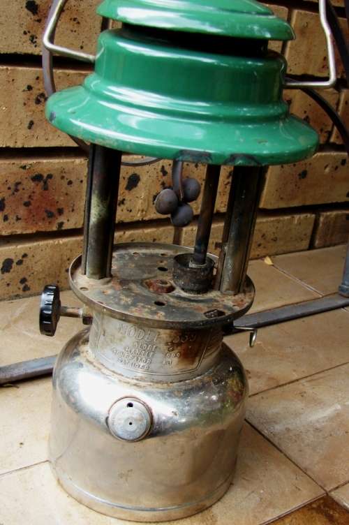 Green and silver Coleman Model 339- Made in Canada 01/1978 Kerosene lamp-no glass