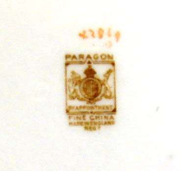 Beautiful oval shaped Paragon-made in England 21 piece tea set with flowers/gold trimmings