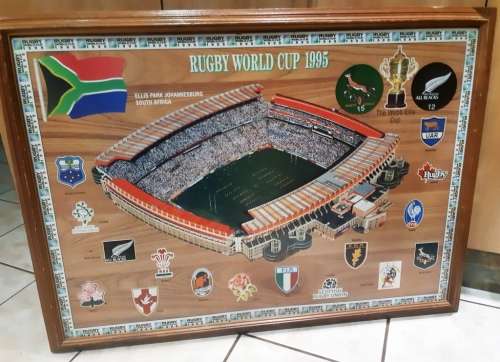 Big official Rugby World Cup final 1995 Ellis Park scene on wooden bord with glass