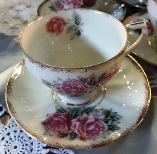 Beautiful 12 piece rose design with gold trimming vintage 12 piece LM tea set