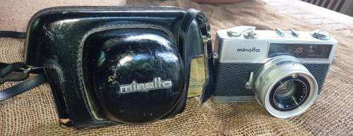 Vintage Minolta Electro Shot Camera with Rokkor-QF 1:18 F40mm lens and leather cover holder