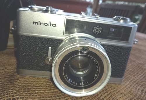Vintage Minolta Electro Shot Camera with Rokkor-QF 1:18 F40mm lens and leather cover holder