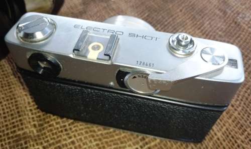 Vintage Minolta Electro Shot Camera with Rokkor-QF 1:18 F40mm lens and leather cover holder