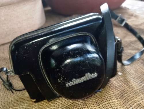 Vintage Minolta Electro Shot Camera with Rokkor-QF 1:18 F40mm lens and leather cover holder