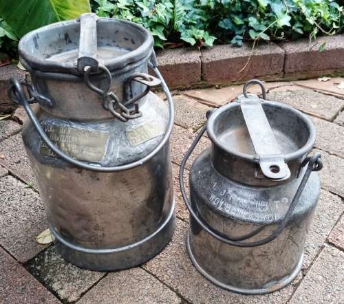 2 Vintage metal Milk Cans with character-sell as set-no holes