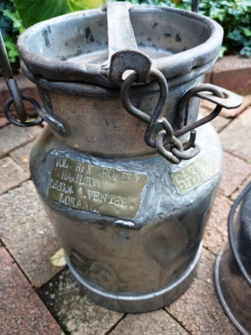 2 Vintage metal Milk Cans with character-sell as set-no holes
