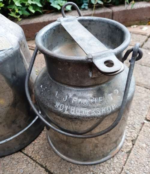 2 Vintage metal Milk Cans with character-sell as set-no holes