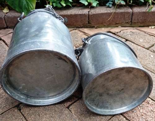 2 Vintage metal Milk Cans with character-sell as set-no holes