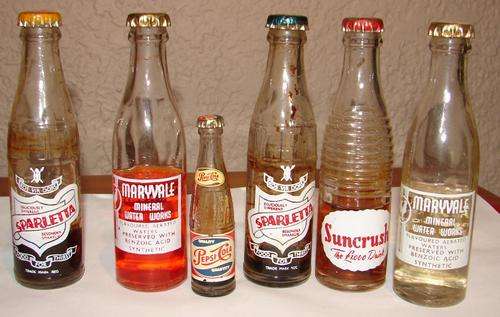 8 Miniature Cool drink Bottles with caps-Bigger ones H 12.5cm, Small Pepsi H 7.5cm