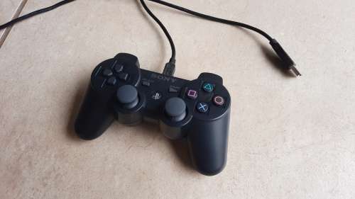 Playstation 3 console + game controllers + 6 games + HDMI cable