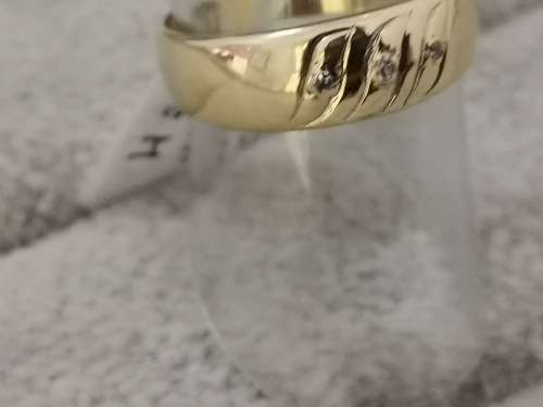 Detailed Gold Ring With Diamonds