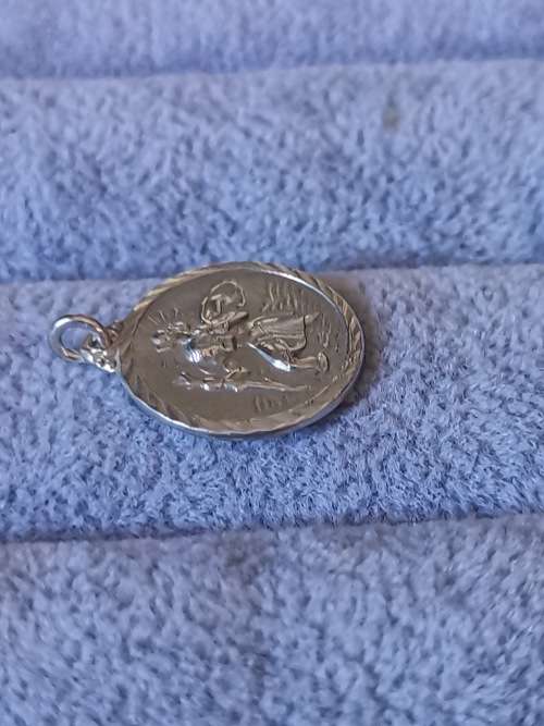 **R1 Auction**  Silver St. Christopher Pendant