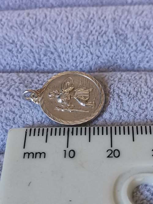 **R1 Auction**  Silver St. Christopher Pendant