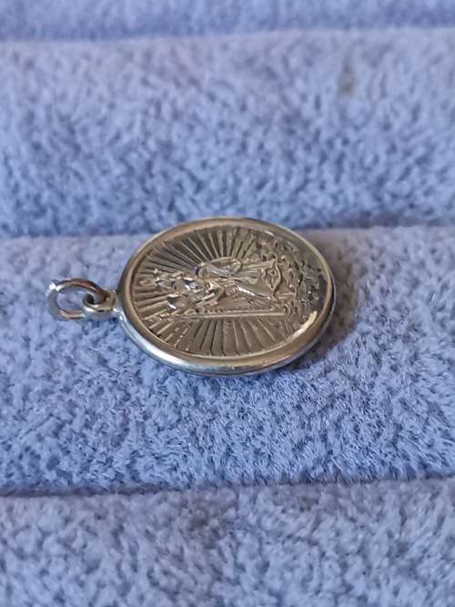 **R1 Auction**  Silver St. Christopher Pendant