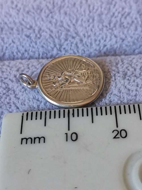 **R1 Auction**  Silver St. Christopher Pendant