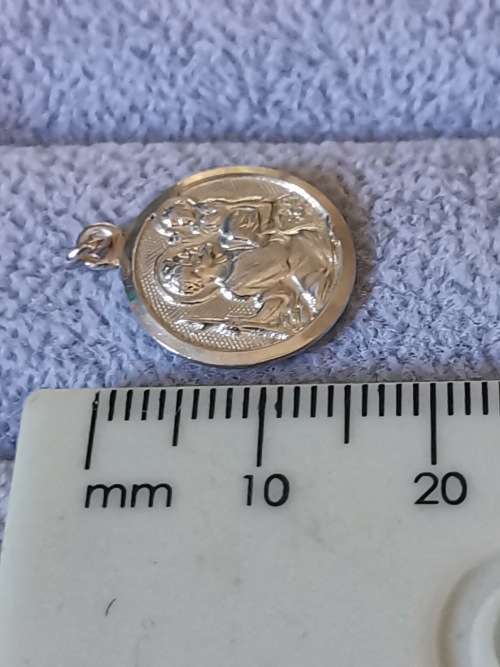 **R1 Auction**  Silver St. Christopher Pendant
