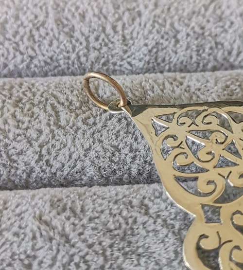 Detailed Silver Pendant