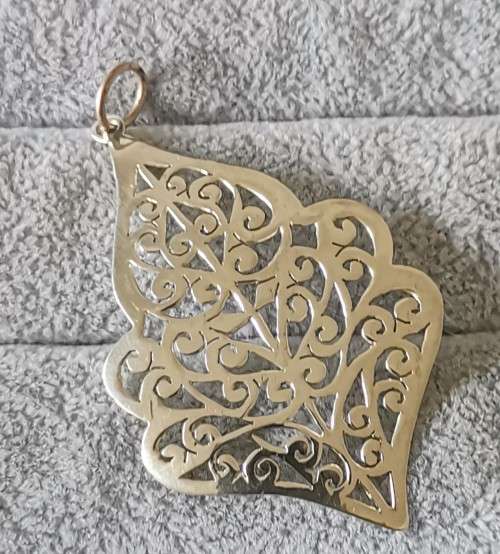 Detailed Silver Pendant