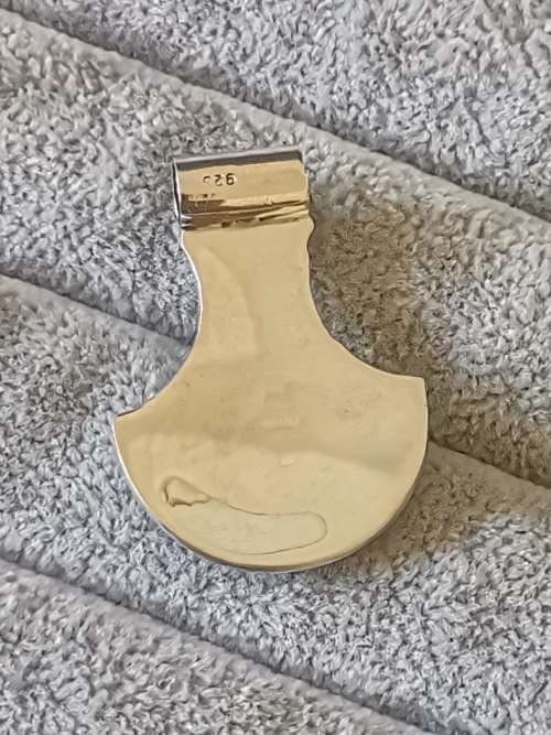 Silver pendant with intricate detailing