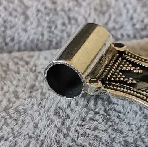 Silver pendant with intricate detailing